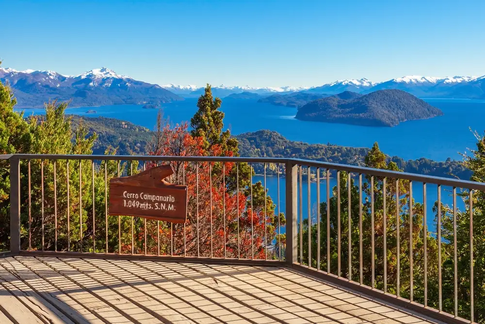 A viewpoint railing above the lakes, with the Cerro Campanario sign on it